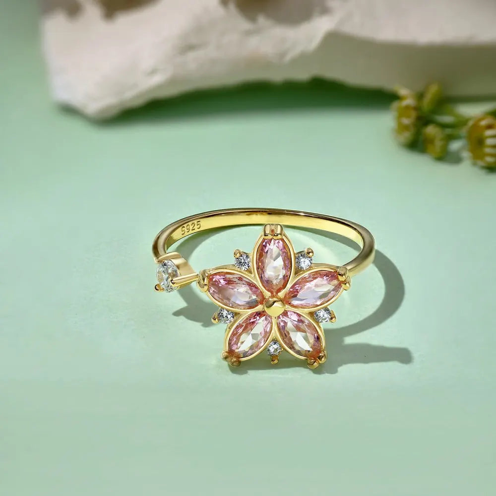 Blomma fidget ring, öppen design i pläterad guld