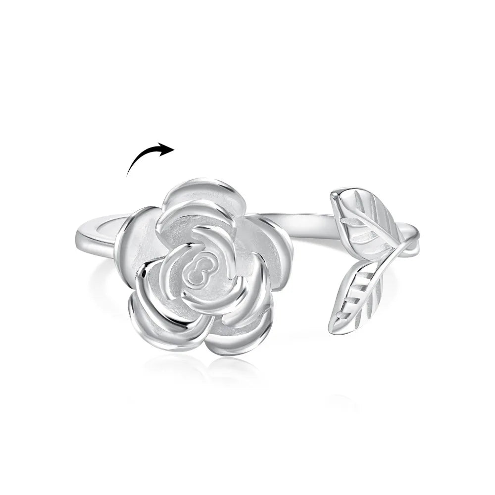 Silver snurr ring med ros som kan roteras, öppen design och passar olika storlekar